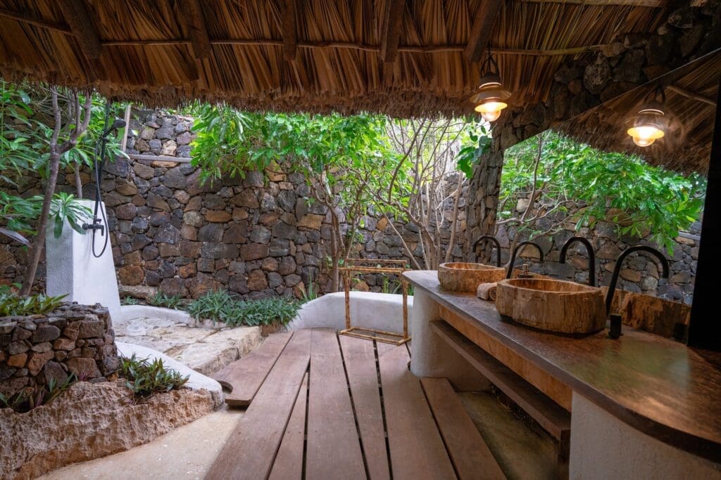 Outdoor double vanity and shower at Boa Vida Rote