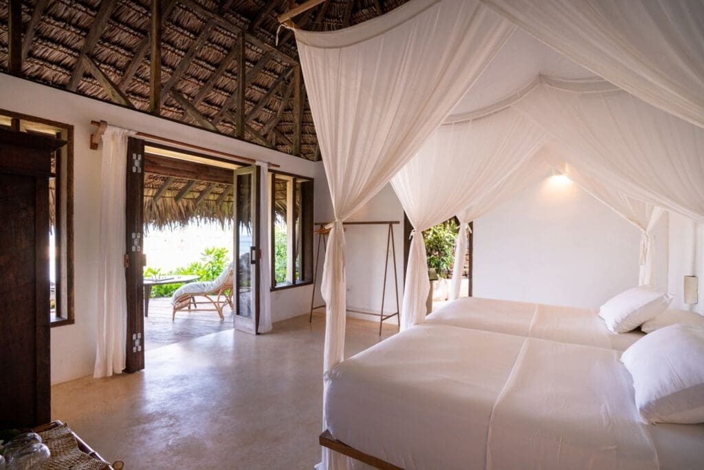 Room interior with canopy bed at Boa Vida Rote