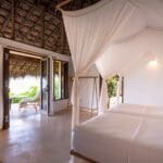 Room interior with canopy bed at Boa Vida Rote
