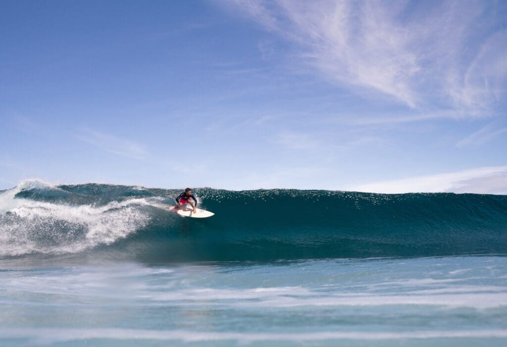 Local surfer riding a wave at Rote Island