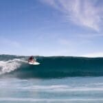 Local surfer riding a wave at Rote Island